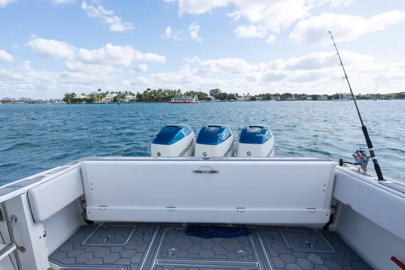 Boss's Therapy Yacht Photos Pics 2007 Intrepid 375 Center Console boat with triple engines on open water.