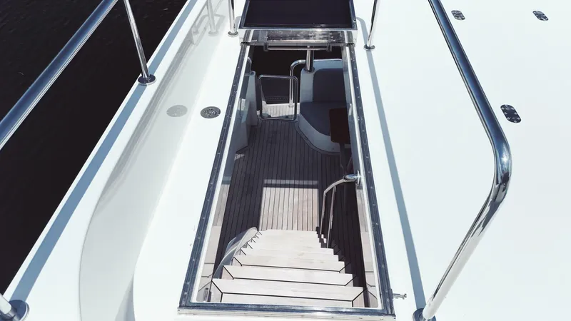 Psyche Yacht Photos Pics Staircase on 2015 Ocean Alexander 72 yacht, featuring sleek design and polished railings.