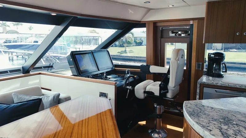 Psyche Yacht Photos Pics Luxurious interior of 2015 Ocean Alexander 72 yacht with helm, seating, and modern amenities.