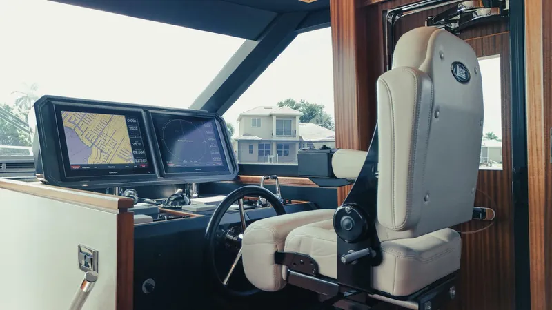 Psyche Yacht Photos Pics Helm of 2015 Ocean Alexander 72 yacht with navigation screens and captain's chair.