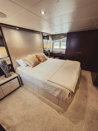 Psyche Yacht Photos Pics Luxurious bedroom interior of 2015 Ocean Alexander 72 yacht with elegant furnishings.