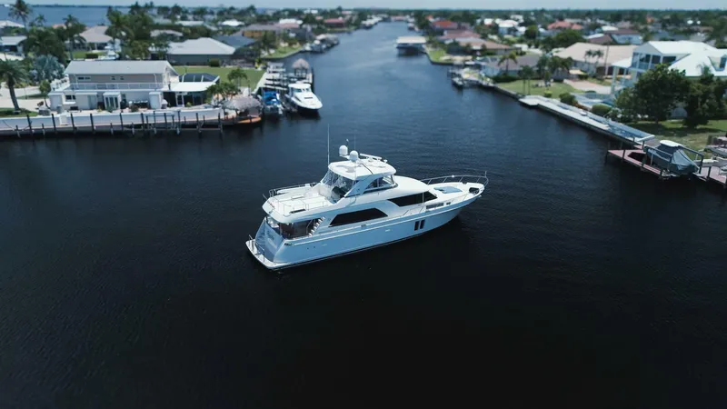 Psyche Yacht Photos Pics Luxurious 2015 Ocean Alexander 72 yacht cruising in a scenic waterfront neighborhood.