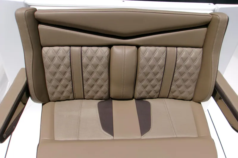  Yacht Photos Pics Luxurious brown leather seat with diamond stitching in a 2026 Monterey Elite 27 OB.
