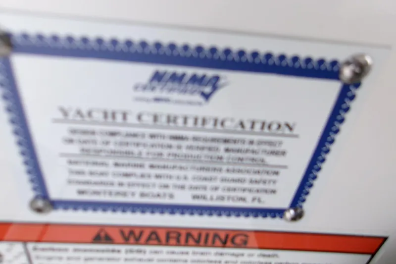  Yacht Photos Pics Blurred yacht certification label on 2026 Monterey Elite 27 OB boat.