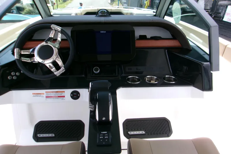  Yacht Photos Pics 2026 Monterey Elite 27 OB boat dashboard with modern steering and control panel.