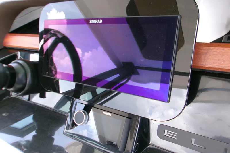  Yacht Photos Pics Dashboard of 2026 Monterey Elite 27 OB with Simrad display and Fusion controls.