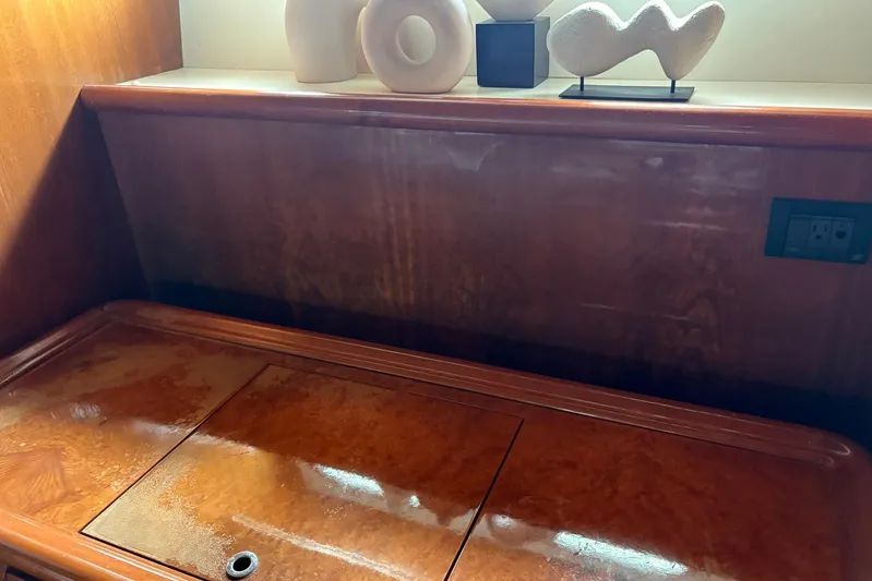 Rabbit Yacht Photos Pics Wooden interior detail of 1999 Ferretti Yachts 80 RPH with modern sculptures.