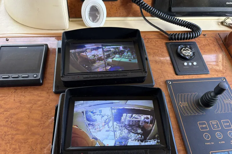 Rabbit Yacht Photos Pics Control panel of a 1999 Ferretti Yachts 80 RPH with screens and navigation equipment.