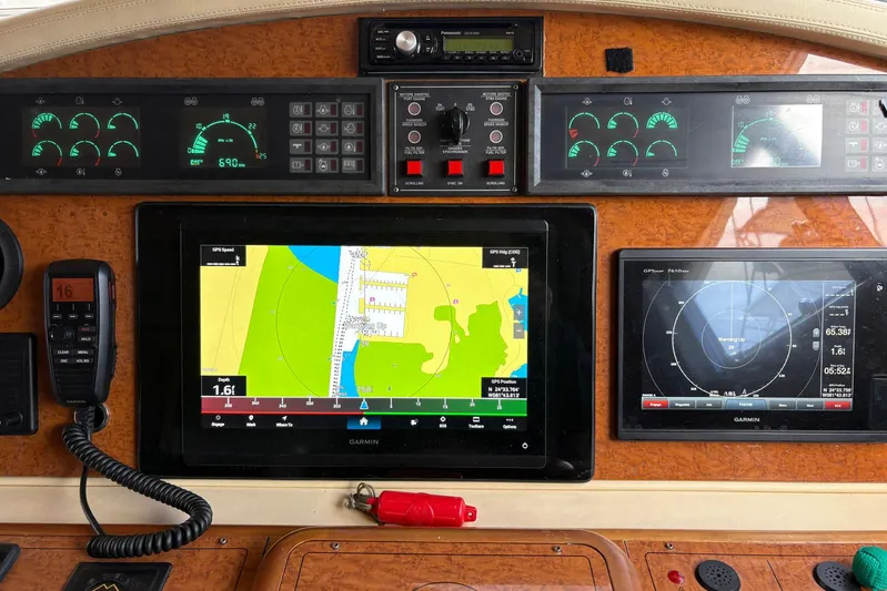 Rabbit Yacht Photos Pics Cockpit of 1999 Ferretti Yachts 80 RPH with navigation and control panels.