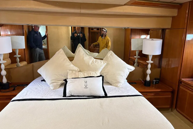 Rabbit Yacht Photos Pics Luxurious bedroom interior of 1999 Ferretti Yachts 80 RPH with elegant bedding and decor.