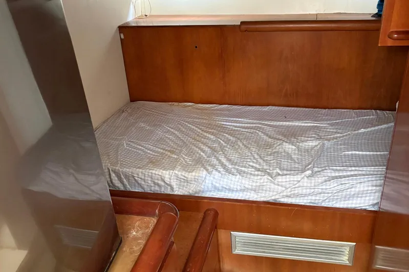 Rabbit Yacht Photos Pics 1999 Ferretti Yachts 80 RPH cabin with wooden interior and single bed.
