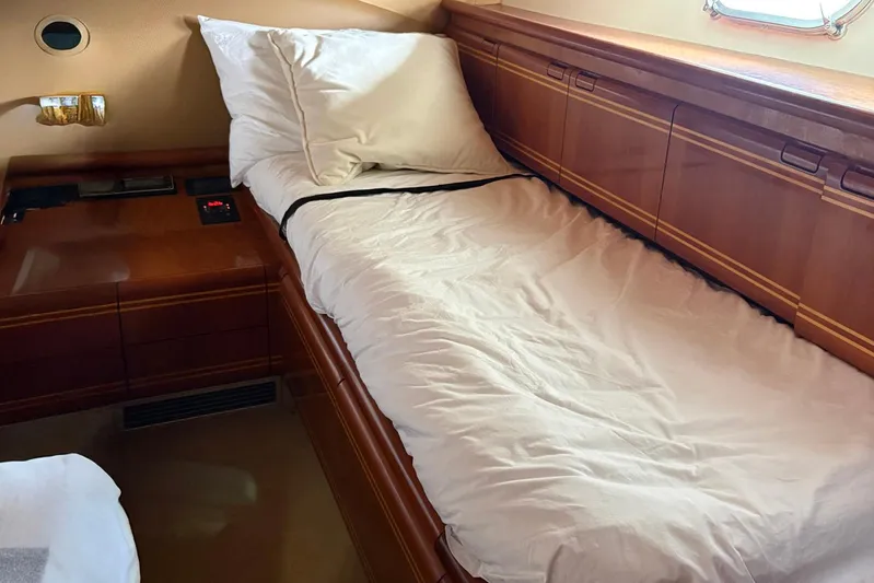 Rabbit Yacht Photos Pics Luxurious cabin interior of 1999 Ferretti Yachts 80 RPH with wooden furnishings.