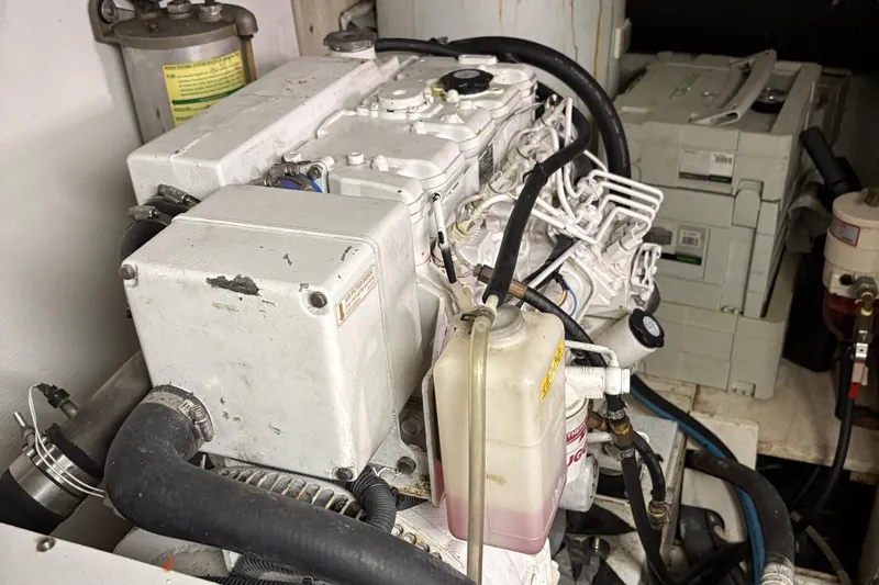 Rabbit Yacht Photos Pics Engine room of a 1999 Ferretti Yachts 80 RPH, showcasing mechanical components.