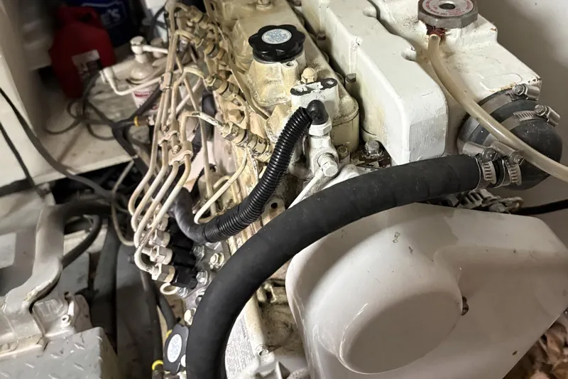 Rabbit Yacht Photos Pics Engine compartment of a 1999 Ferretti Yachts 80 RPH, showcasing intricate mechanical components.