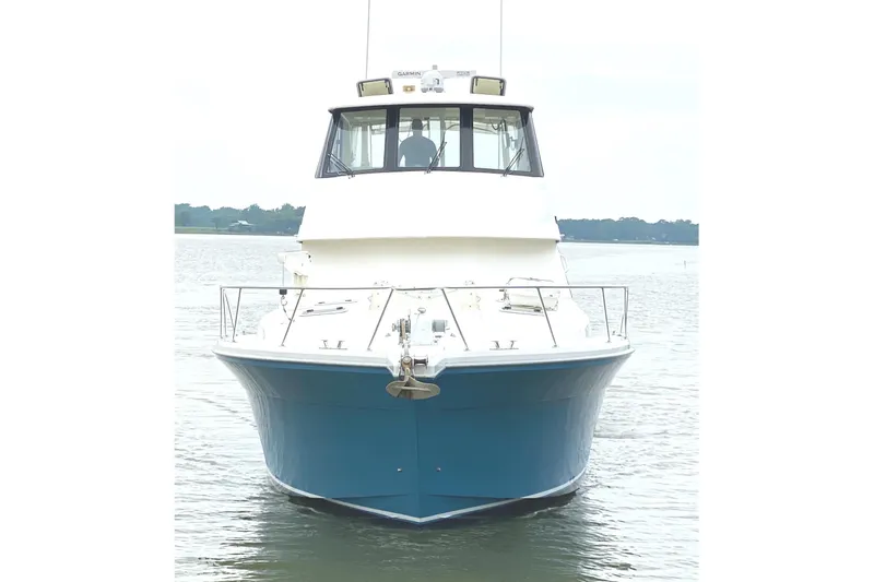  Yacht Photos Pics 1999 Riviera Convertible SF boat on calm water, front view.