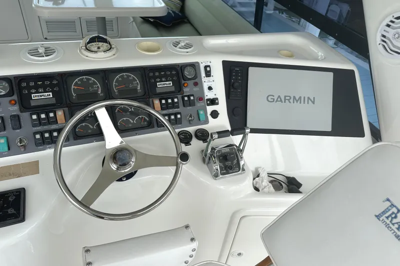  Yacht Photos Pics 1999 Riviera Convertible SF boat dashboard with Garmin navigation system and Caterpillar gauges.