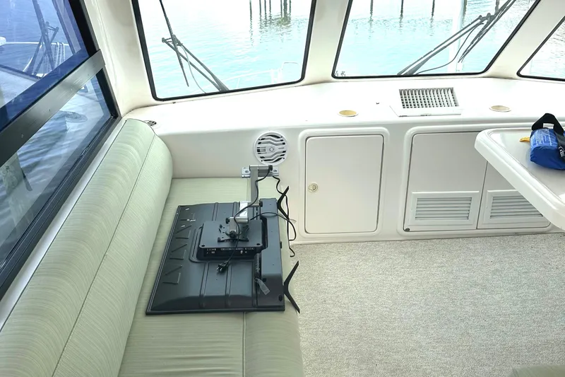  Yacht Photos Pics Interior of 1999 Riviera Convertible SF boat with seating and mounted equipment.