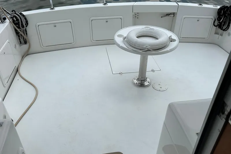  Yacht Photos Pics 1999 Riviera Convertible SF boat deck with life preserver and storage compartments.