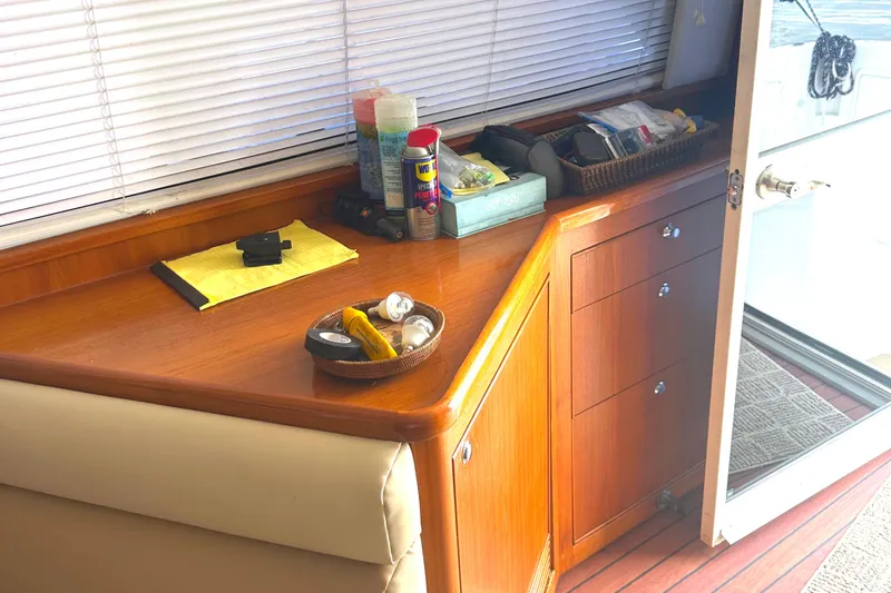  Yacht Photos Pics Interior of 1999 Riviera Convertible SF with wooden cabinetry and various items on the counter.
