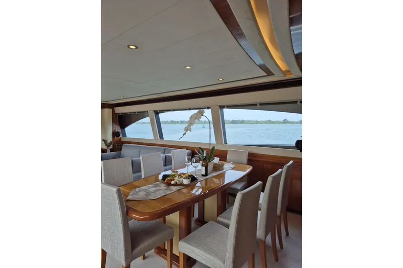  Yacht Photos Pics Luxurious dining area on a 2006 Ferretti Yachts 830 with elegant table setting.