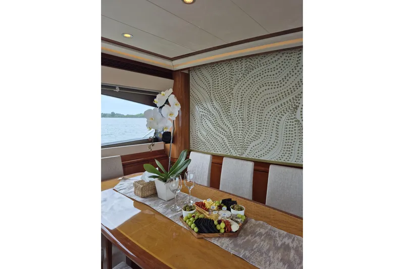  Yacht Photos Pics Luxurious dining area on a 2006 Ferretti Yachts 830 with elegant decor and scenic view.