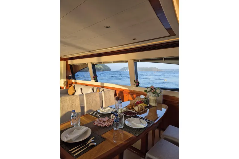  Yacht Photos Pics Luxurious dining area on a 2006 Ferretti Yachts 830 with ocean view.