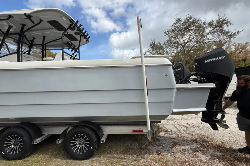  Yacht Photos Pics 2022 Eastward 30 boat on trailer with Mercury outboard engines, parked outdoors.
