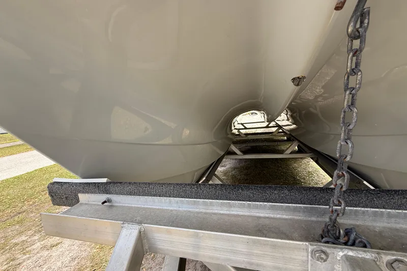  Yacht Photos Pics Underside view of 2022 Eastward 30 boat on trailer, showcasing hull design.