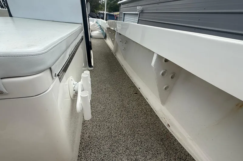  Yacht Photos Pics 2022 Eastward 30 boat interior with rod holders and cushioned seating.