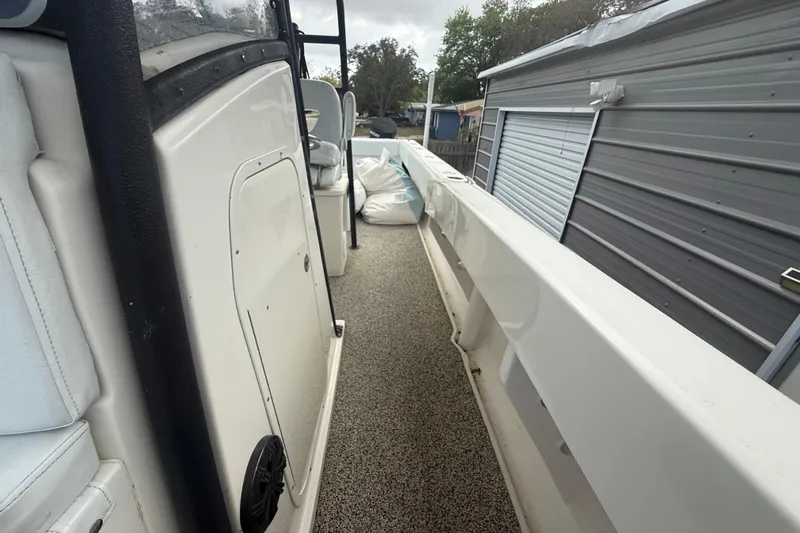  Yacht Photos Pics 2022 Eastward 30 boat interior with white seating and storage compartments.