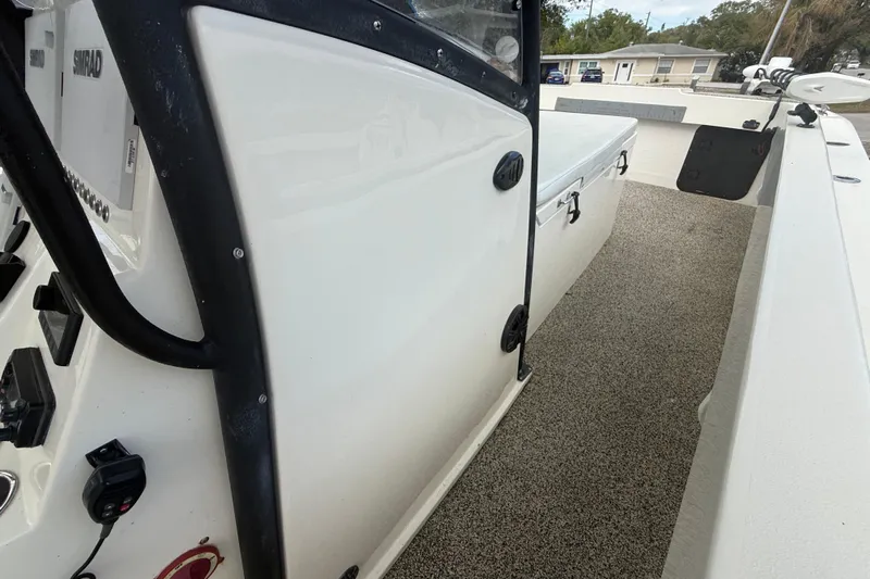  Yacht Photos Pics 2022 Eastward 30 boat interior with Simrad electronics and storage compartment.