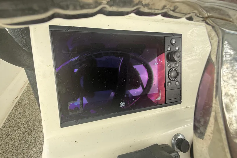  Yacht Photos Pics Control panel of a 2022 Eastward 30 boat with display screen and buttons.