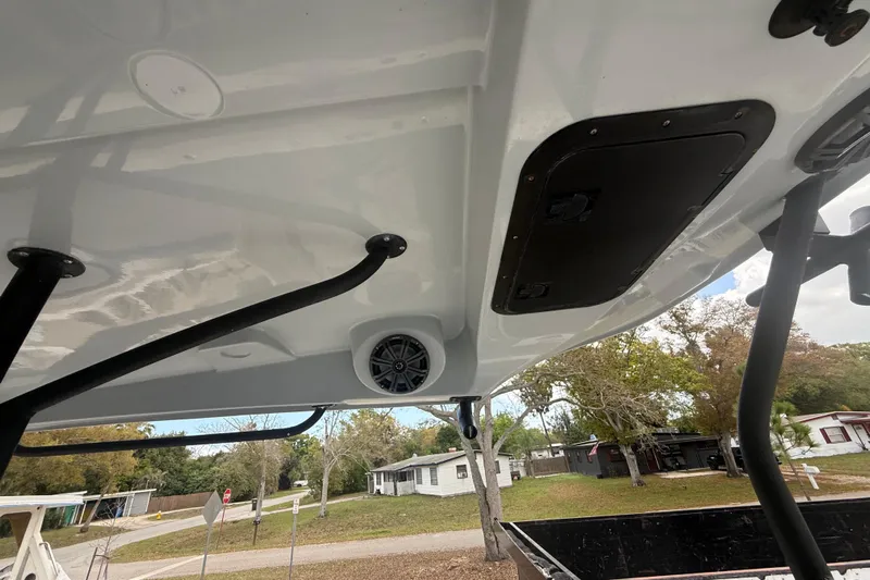  Yacht Photos Pics 2022 Eastward 30 boat interior with speaker and hatch, showcasing sleek design.