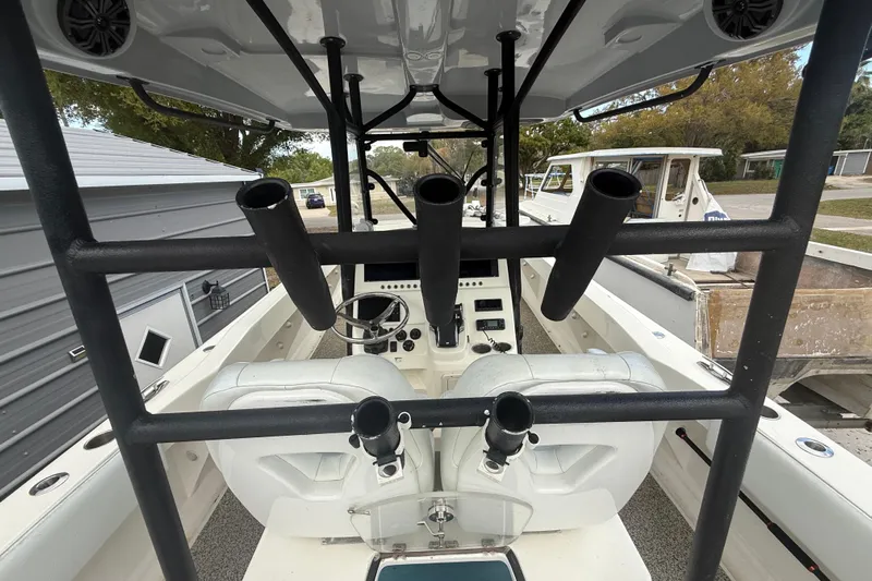  Yacht Photos Pics Interior view of a 2022 Eastward 30 boat, featuring rod holders and steering console.