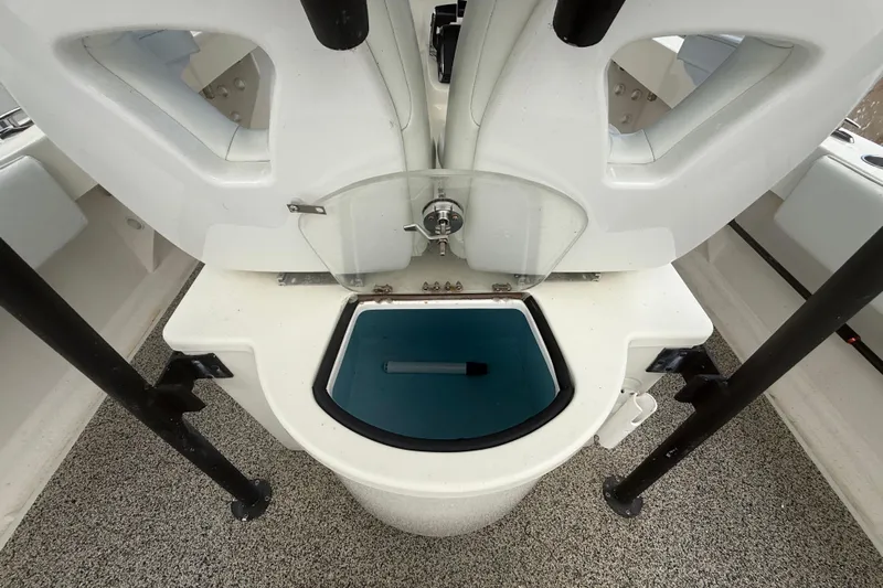  Yacht Photos Pics Livewell on 2022 Eastward 30 boat, featuring white seating and blue interior.