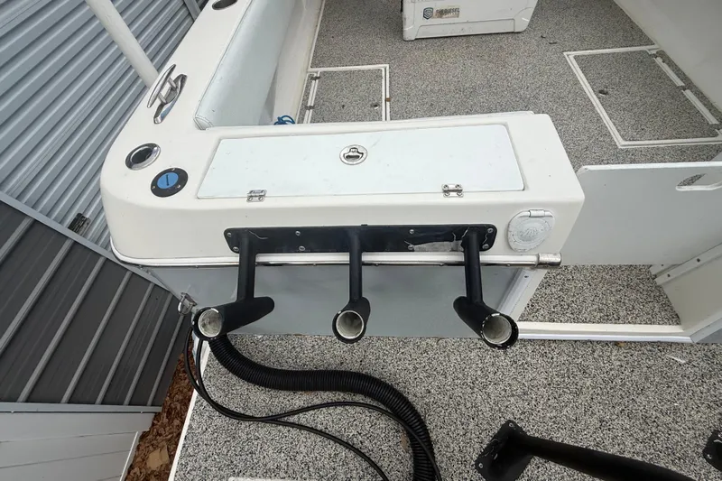  Yacht Photos Pics 2022 Eastward 30 boat interior with rod holders and storage compartments.