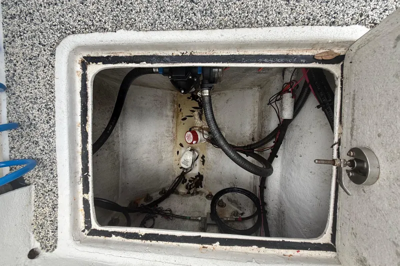  Yacht Photos Pics Open compartment of 2022 Eastward 30 boat showing internal wiring and components.