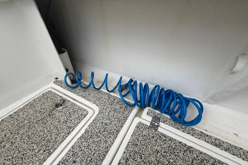  Yacht Photos Pics Coiled blue hose on Eastward 30 boat deck, 2022 model.