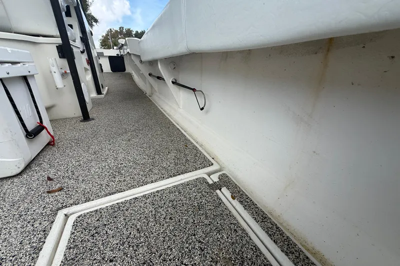  Yacht Photos Pics Interior view of a 2022 Eastward 30 boat, featuring textured flooring and storage compartments.