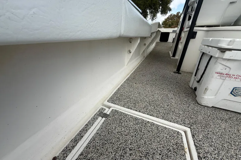  Yacht Photos Pics Interior view of 2022 Eastward 30 boat, featuring textured flooring and storage compartments.