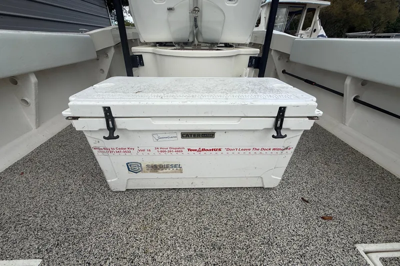  Yacht Photos Pics White cooler on Eastward 30 boat deck, 2022 model, with safety and service stickers.