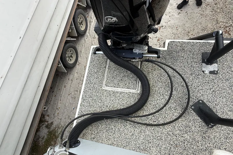  Yacht Photos Pics Top view of a 2022 Eastward 30 boat deck with motor and cables.