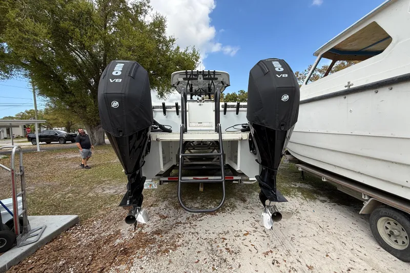  Yacht Photos Pics Twin V8 outboard engines on a 2022 Eastward 30 boat, parked outdoors.