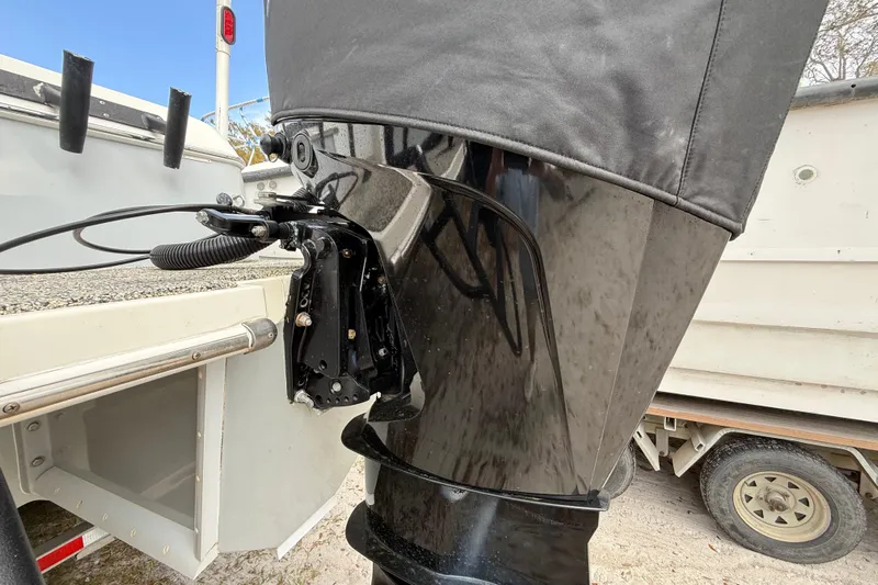  Yacht Photos Pics 2022 Eastward 30 boat engine with protective cover, parked on a trailer.