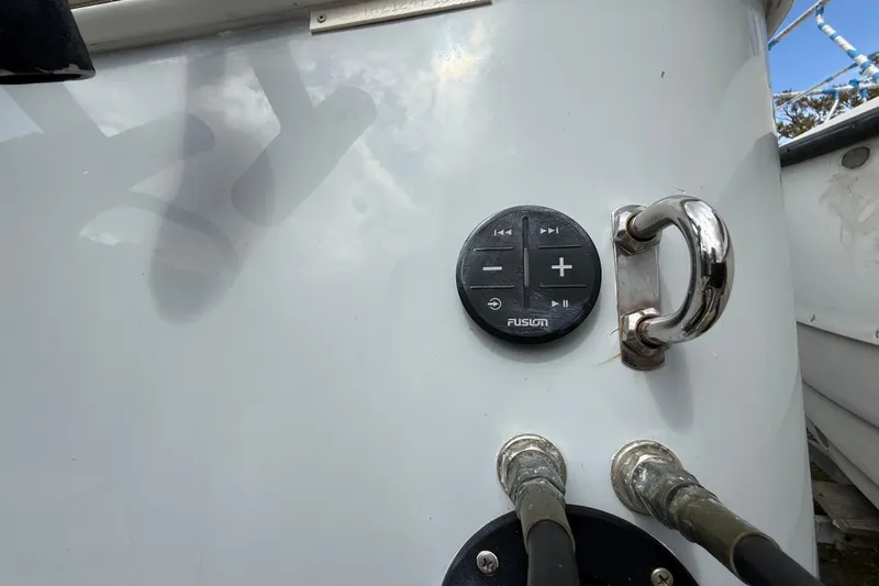  Yacht Photos Pics Control panel on Eastward 30 boat, featuring Fusion audio controls and metal handle, 2022 model.