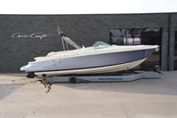 2024 Chris-Craft Launch 28 GT boat on trailer outside showroom.