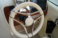 2024 Chris-Craft Launch 28 GT steering wheel with luxurious design and wood accents.