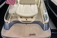 2024 Chris-Craft Launch 28 GT boat with elegant seating and American flag.
