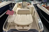 2024 Chris-Craft Launch 28 GT boat with luxurious seating and American flag.
