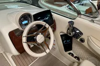 2024 Chris-Craft Launch 28 GT dashboard with steering wheel and modern controls.